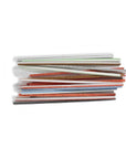 a stack of sanding twigs laying horizontally on a white background
