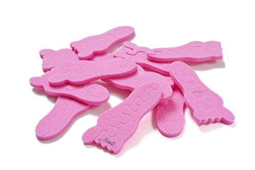 Teenie toe separators. Pink toe separators in the shape of a baby foot. White background