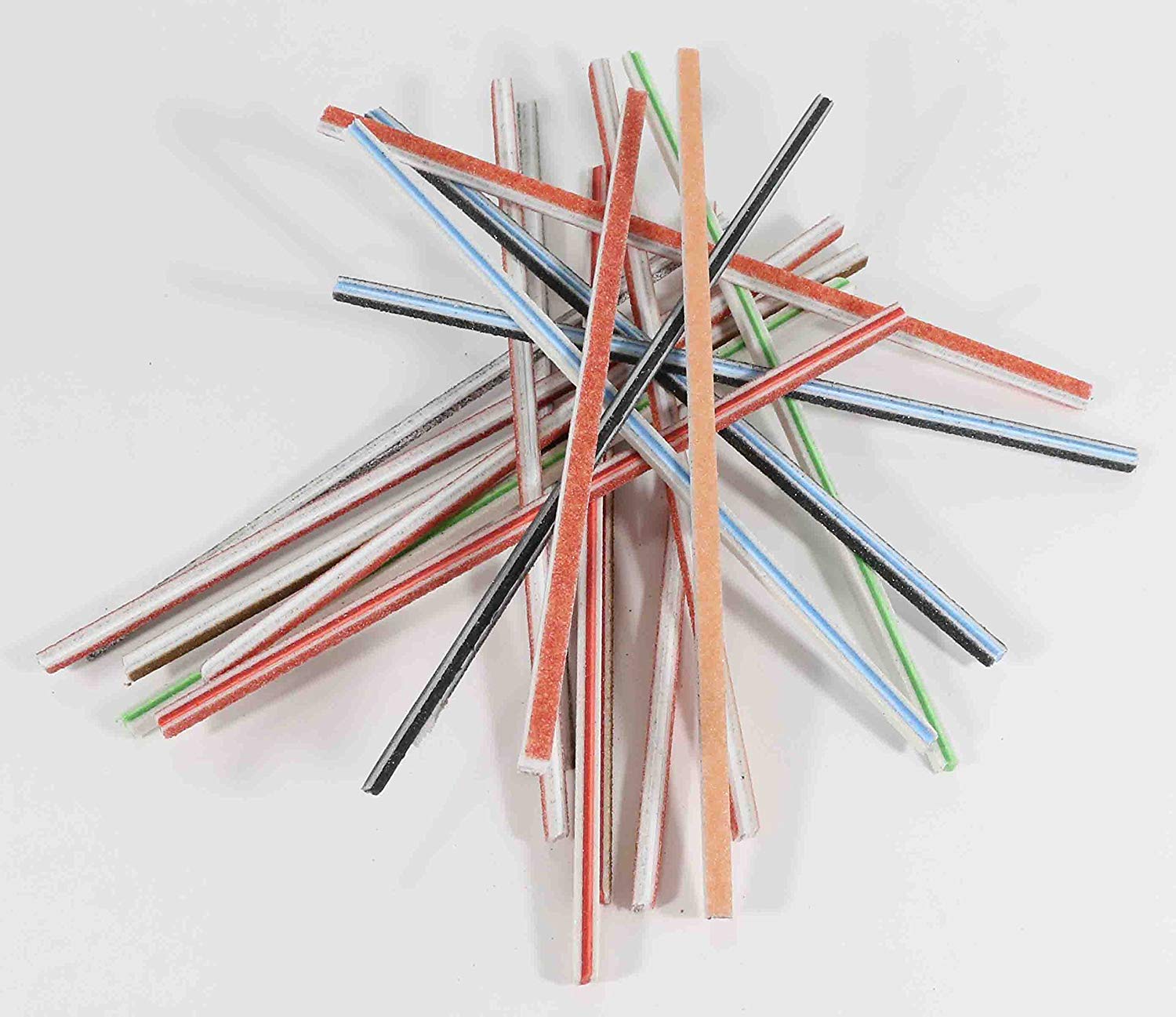a bunch of twigs mixed up on the table showing many colored centers and sandpaper.