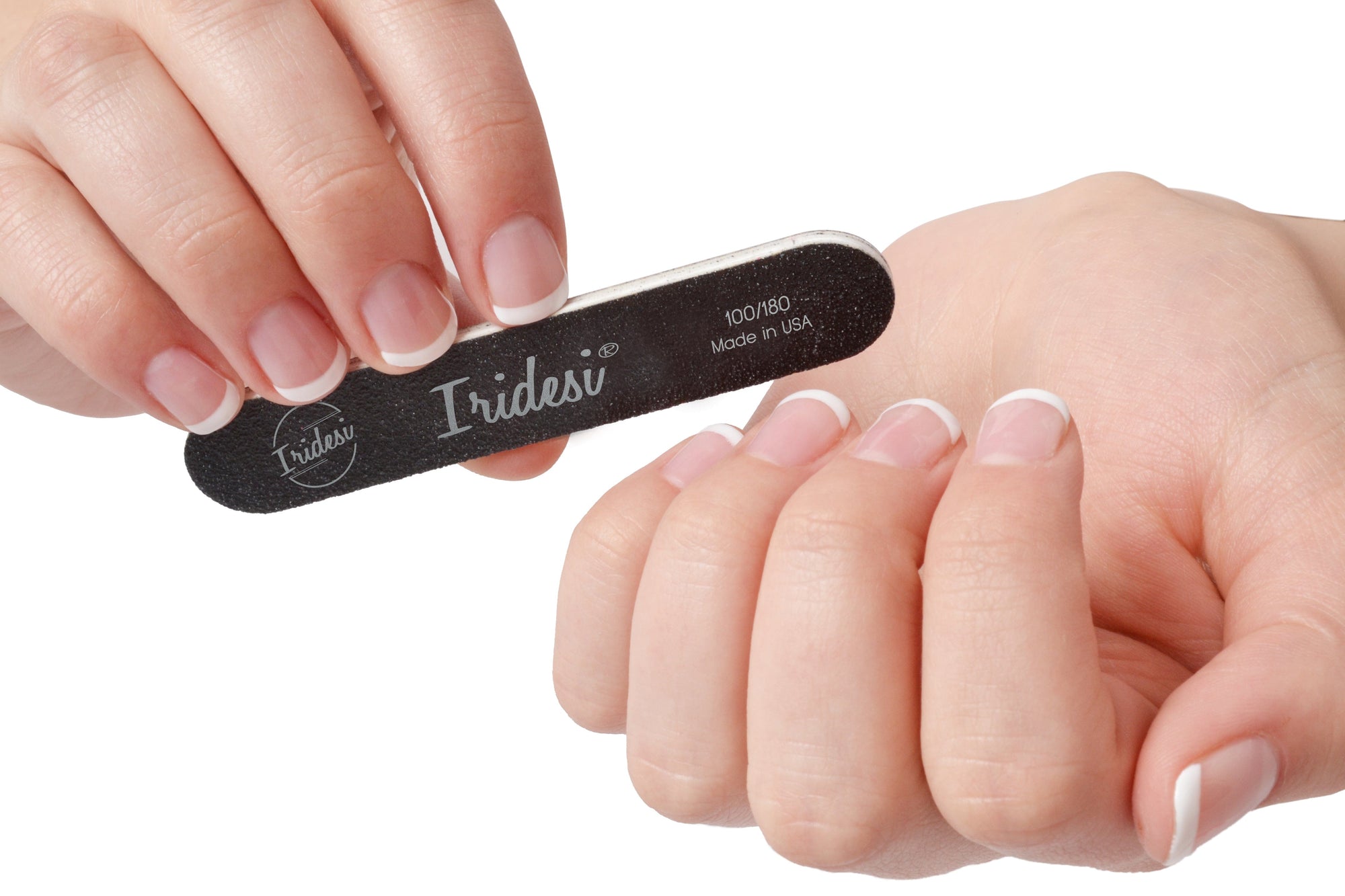 mini black nail files 100/180 grit, white background, white plastic center. women holding one nail file with French manicure.