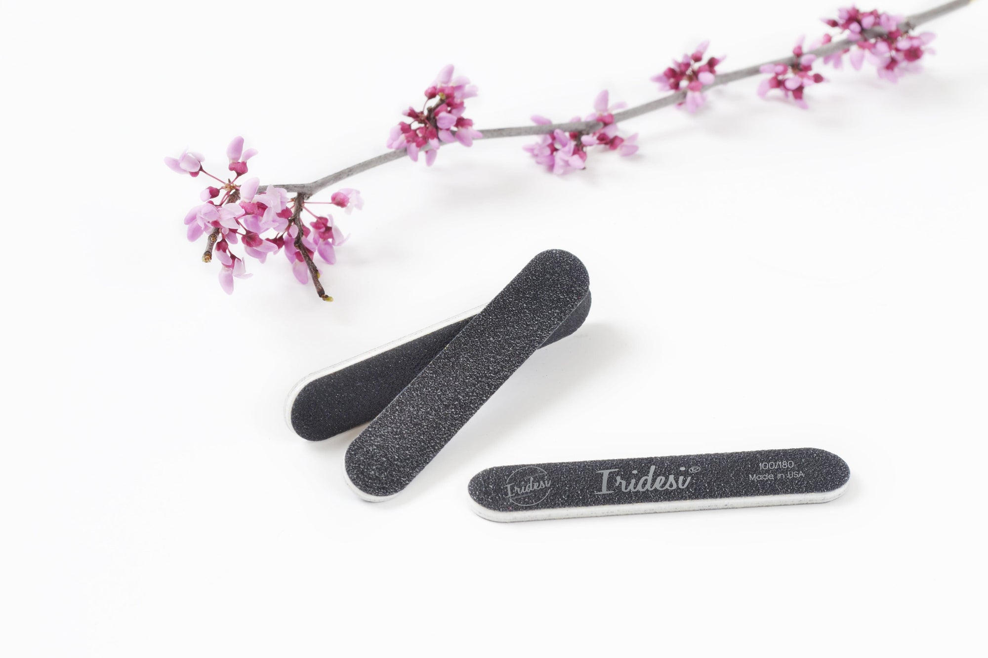 mini black nail files 100/180 grit, white background, white plastic center.