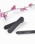 mini black nail files 100/180 grit, white background, white plastic center.