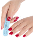 women hands with red fingernails holding an Iridesi mini blue nail file light side visible with logo, name and grit 120/240