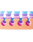 Iridesi toe separators colors are purple, blue, orange, pink on one side white on the other.